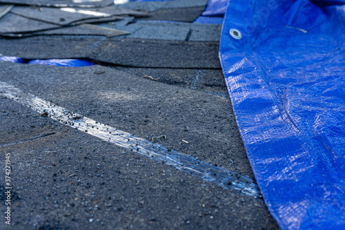 Slika na platnu Roof shingles on blue tarp