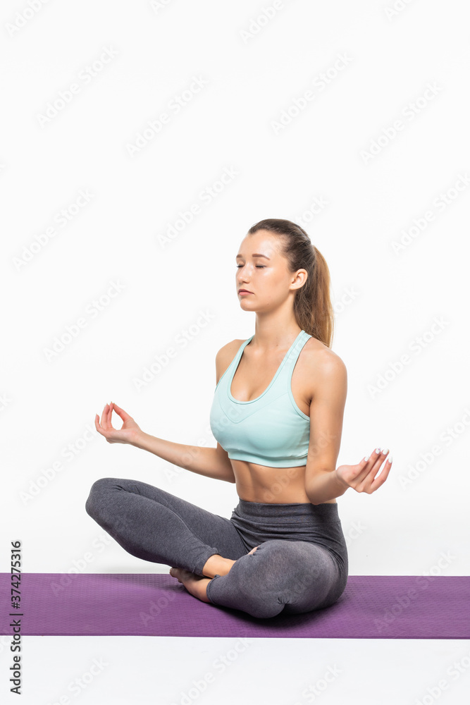 calm pretty woman doing yoga exercise isolated on white background
