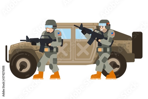 Two young American soldiers accompany a military SUV