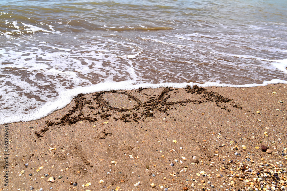 drawn numbers 2021 on the sea sand drawn numbers 2021 on the sea sand
