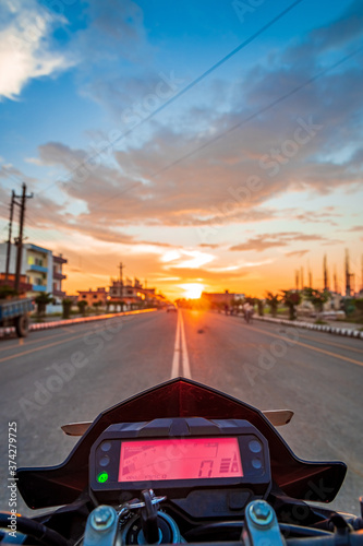 Wallpaper Mural POV Motorbike Speedometer Against The Setting Sun on the Highway. Torontodigital.ca