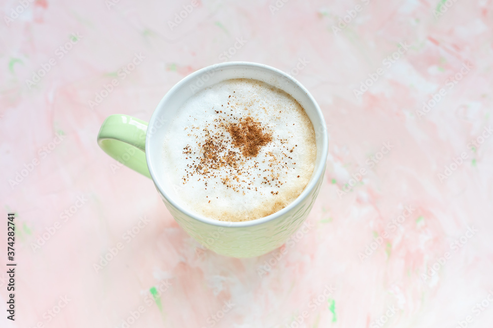 Cup of cinnamon spiced latte coffee on light pink rustic backround. Flat lay, top view, copy space, social media hero header template. Cup of cinnamon spiced latte coffee on light pink rustic backround. Flat lay, top view, copy space, social media hero header template.