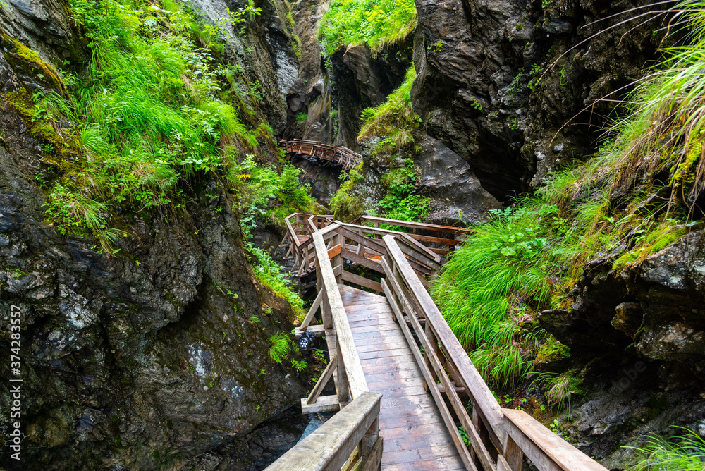 Sigmund Thun Gorge. Cascade valley of wild Kapruner Ache near Kaprun, Austria Sigmund Thun Gorge. Cascade valley of wild Kapruner Ache near Kaprun, Austria