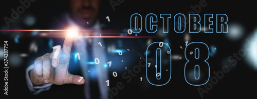 october 8th. Day 8 of month, announcement of date of business meeting or event. businessman holds the name of the month and day on his hand. autumn month, day of the year concept