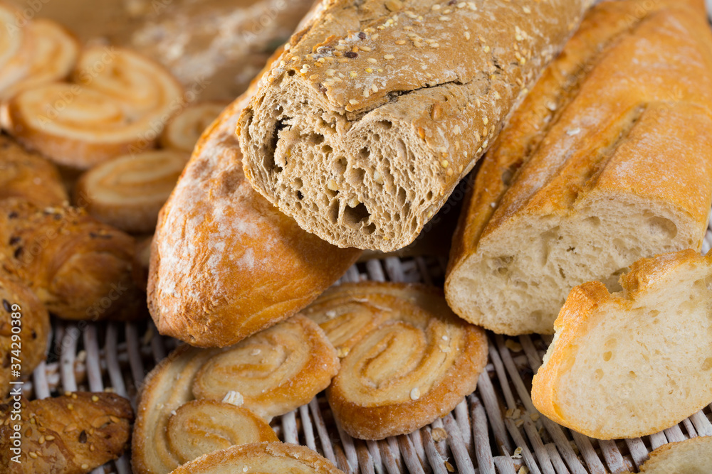Picture of different assortment of bread and bakery products on table