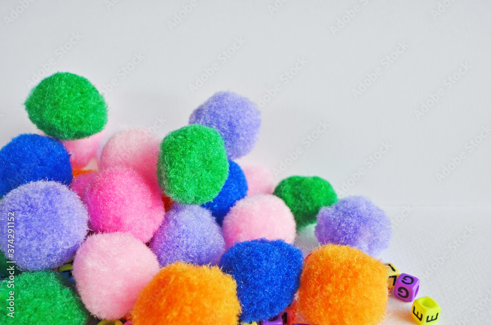 Beautiful colored flannel ball heap on white paper floor