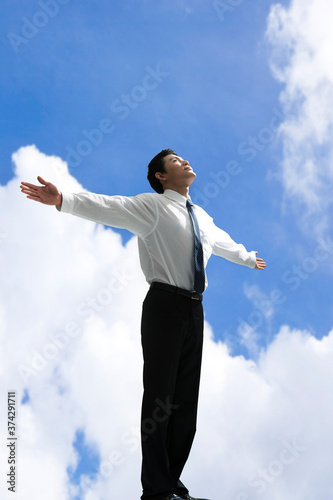 businessman standing with open arms