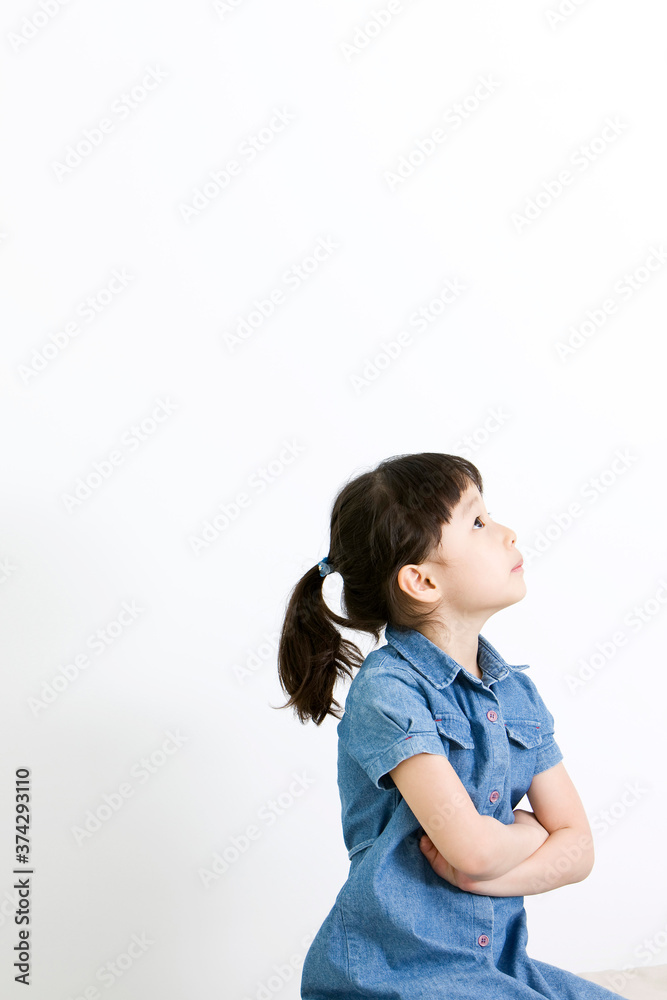 girl thinking with folded arms on white background girl thinking with folded arms on white background