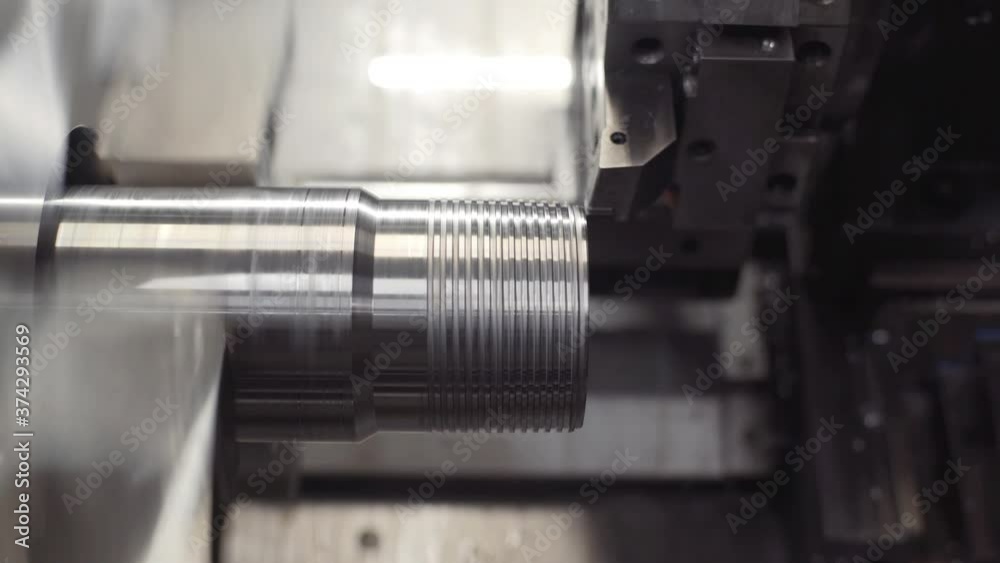 Turning lathe in action. Facing operation of metal blank on turning machine with cutting tool. Old turning lathe machine in turning workshop. Machining high precision mold part by cnc Turning lathe in action. Facing operation of metal blank on turning machine with cutting tool. Old turning lathe machine in turning workshop. Machining high precision mold part by cnc