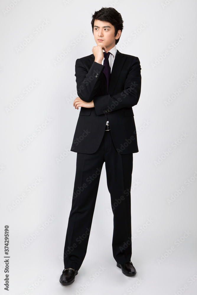 businessman thinking with folded arms businessman thinking with folded arms