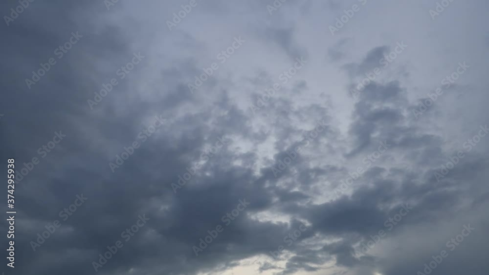 Dramatic b-roll TimeLapse of dark storm clouds & gray cumulus or cirrocumulus cloudscape slowly moved on bright sunrise sky with sun light rays & sunbeam shining through tropical summer horizon Dramatic b-roll TimeLapse of dark storm clouds & gray cumulus or cirrocumulus cloudscape slowly moved on bright sunrise sky with sun light rays & sunbeam shining through tropical summer horizon