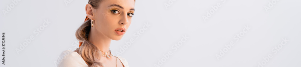 blonde woman looking at camera isolated on white, panoramic shot