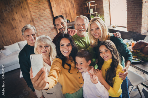 Portrait of nice attractive big full cheerful family brother sister enjoying festal occasion taking sekfie showing v-sign at modern loft industrial brick wooden interior house apartment