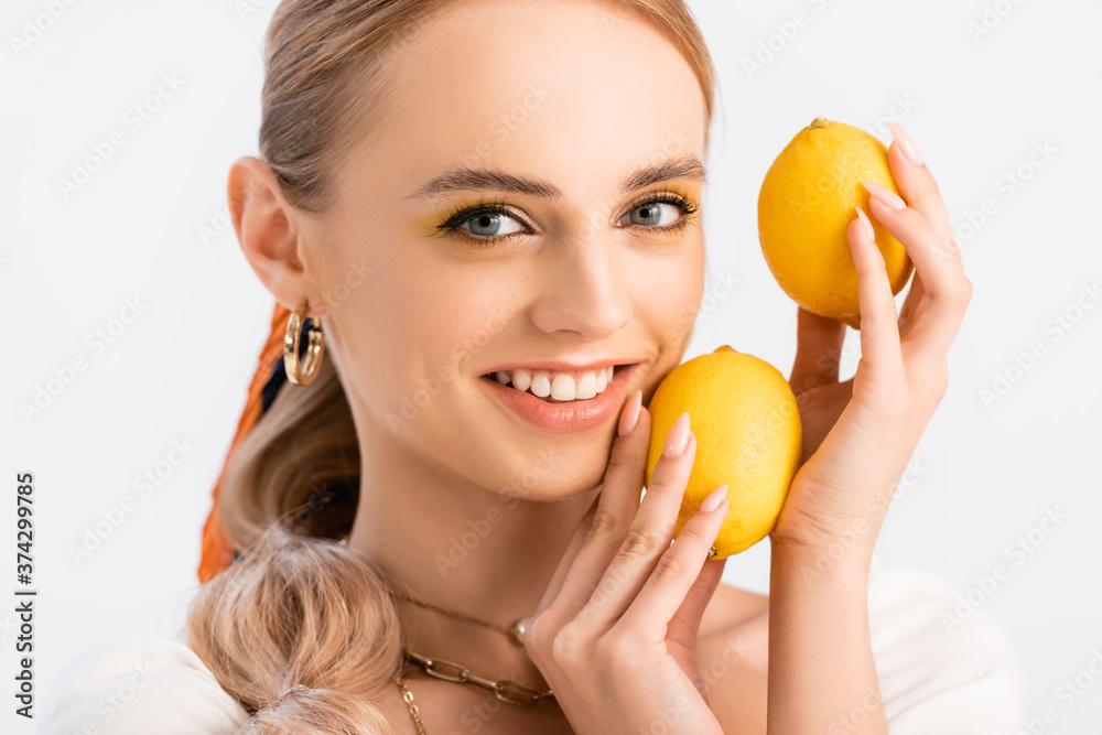 blonde woman posing with yellow lemons isolated on white blonde woman posing with yellow lemons isolated on white