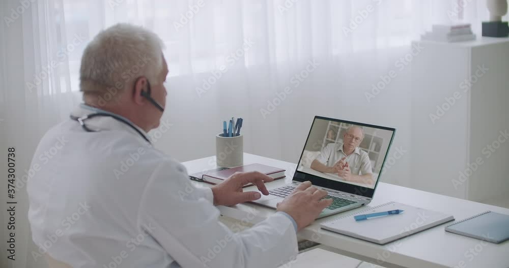 old man is calling his family physician by video call to consult about health and treatments, telemedicine