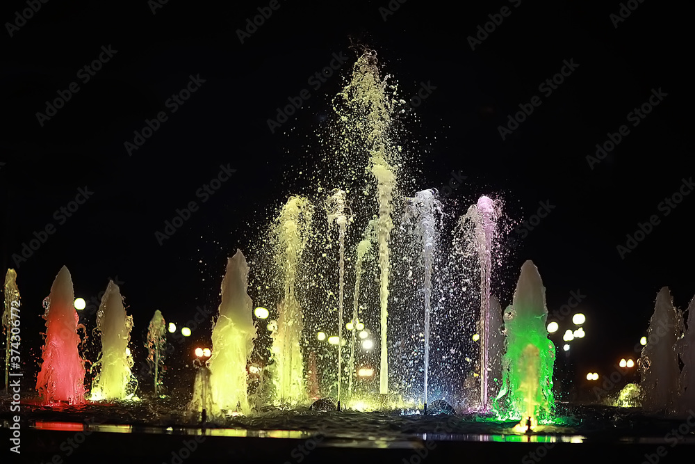 colorful night fountains / jets of colored water in a fountain, night illumination in the city, tourist object art