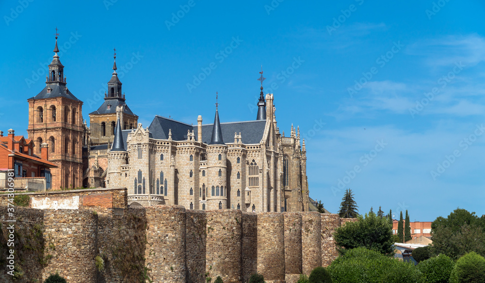 Astorga, Castilla y Leon / Spain - August 11, 2020: The Roman wall, the Episcopal Palace and the Cathedral of Astorga