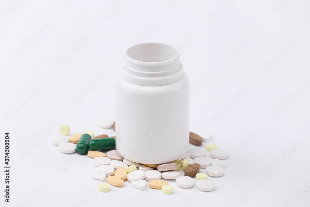 Pills bottle on white background close up Pills bottle on white background close up