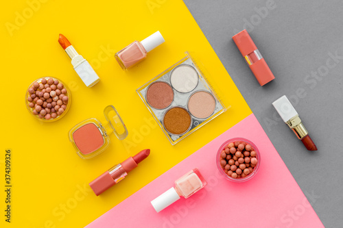Set of decorative makeup cosmetics on colorful background, top view