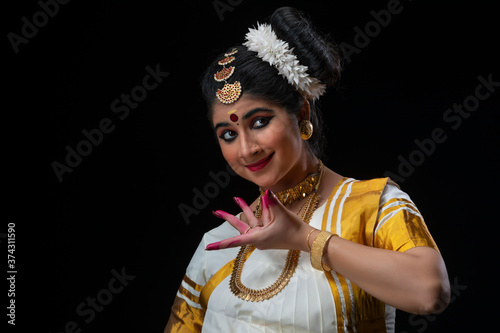 Mohiniattam artist singing a melodious song
 photo