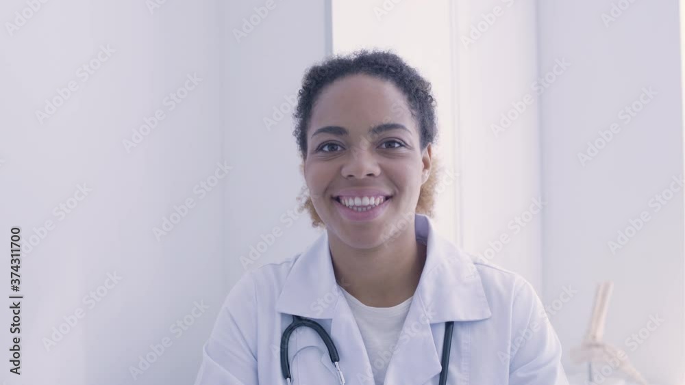 Medical specialist smiling on camera, health care, visit to doctor in clinic Medical specialist smiling on camera, health care, visit to doctor in clinic