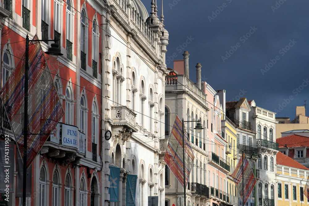 colorful streets with majestic facades, windows and balconies of Lisbon city in Portugal
