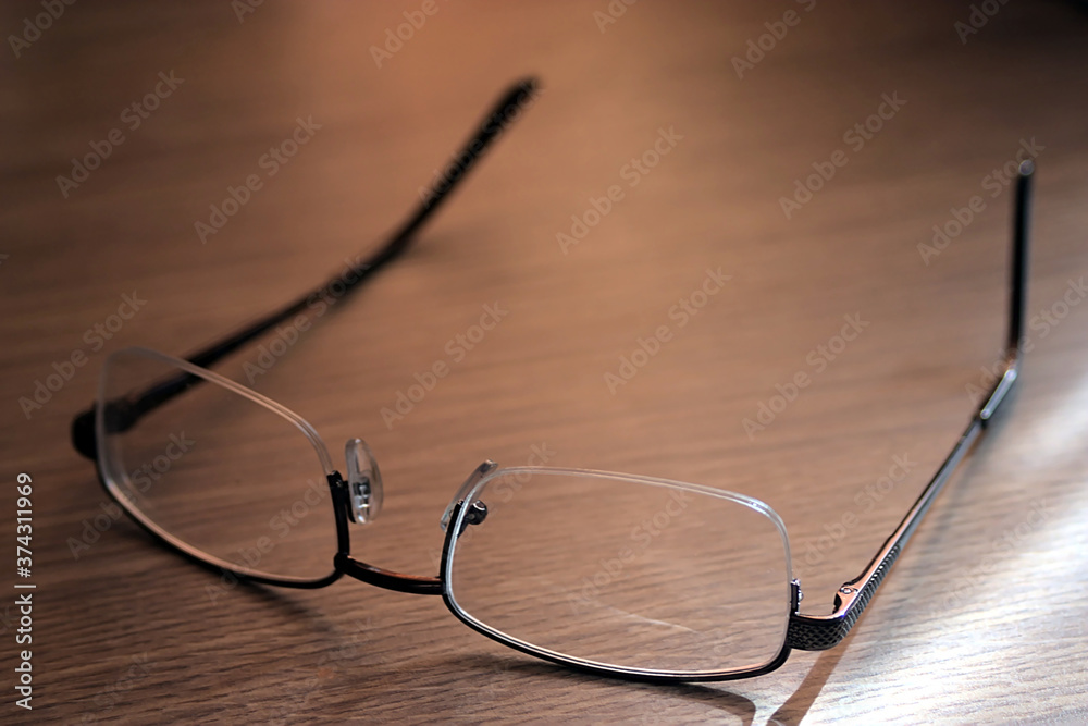 eyeglasses on the table surface in the light eyeglasses on the table surface in the light