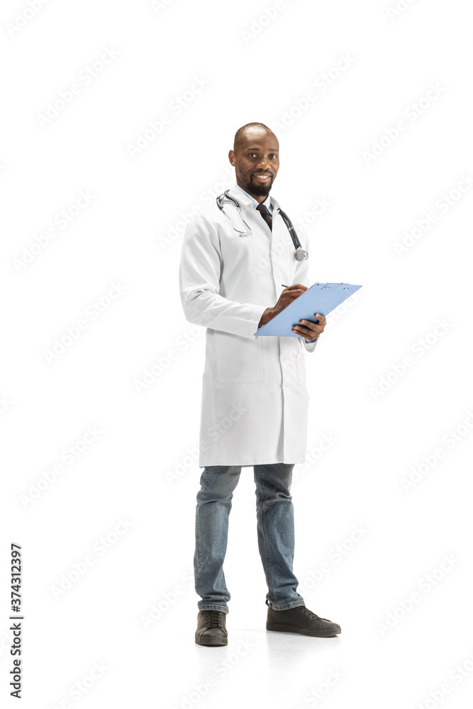 Paperwork. African-american doctor isolated on white background, professional occupation. Daily hard work for health and lives saving. Full length portrait. Medicine, healthcare, profession concept.