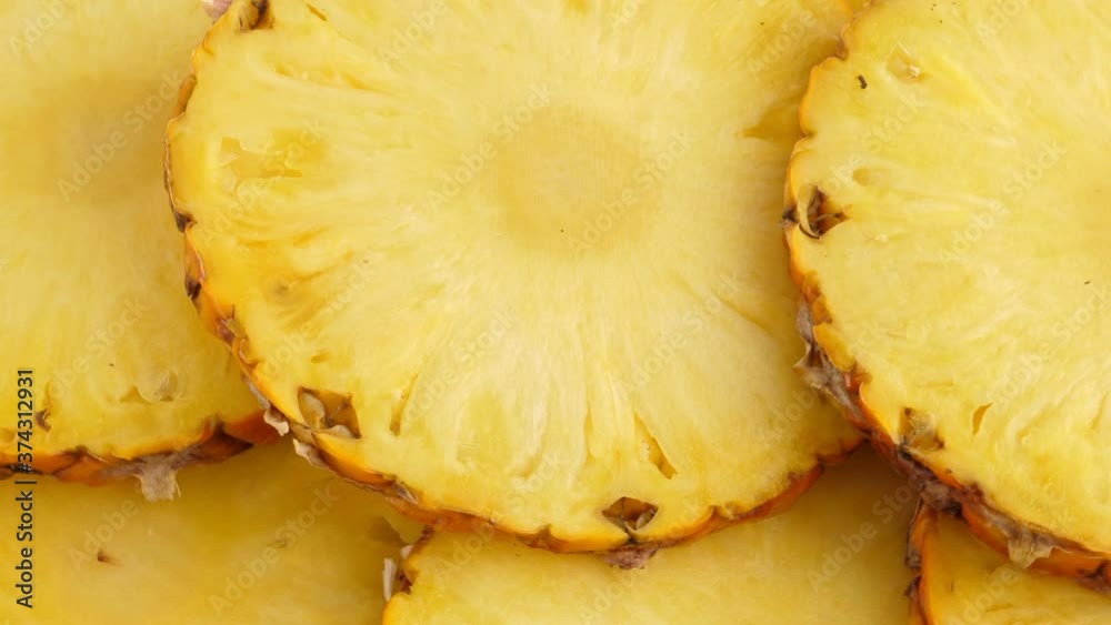 Sliced pieces of pineapple fruit. rotating food Sliced pieces of pineapple fruit. rotating food