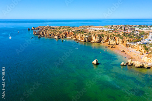 Aerial from Praia do Camillo on a rocky southcoast near Lagos in Portugal © Nataraj