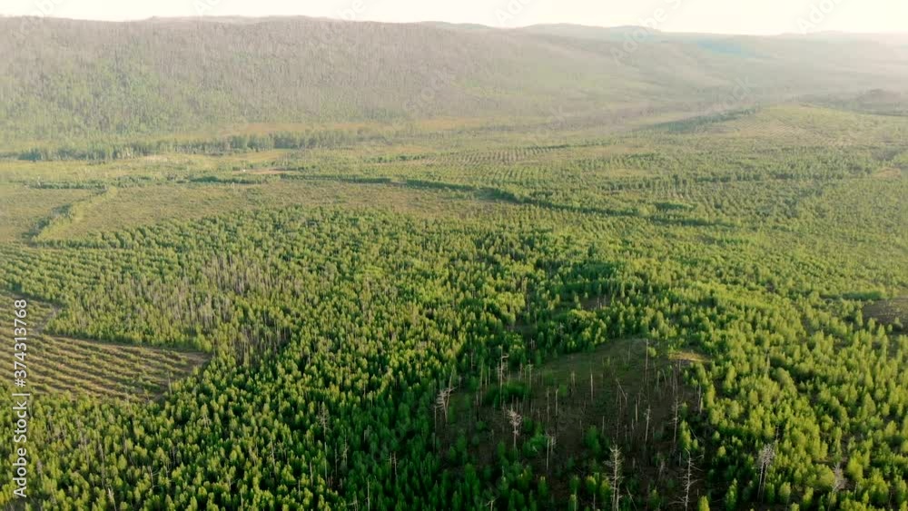 Aerial panoramic view from drone of rural village among fields, forests, river and hills. Winding road and highway. Aerial panoramic view from drone of rural village among fields, forests, river and hills. Winding road and highway.