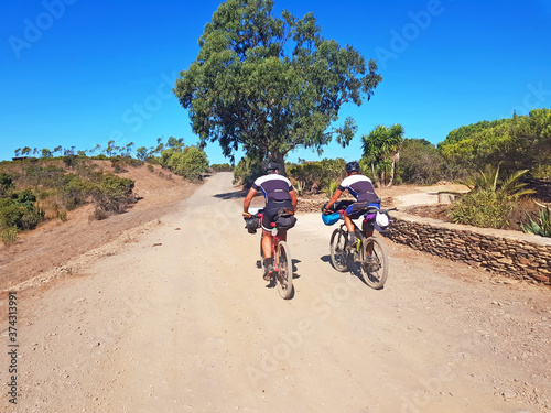 Bikers on a dirt road in the countryside from Portugal