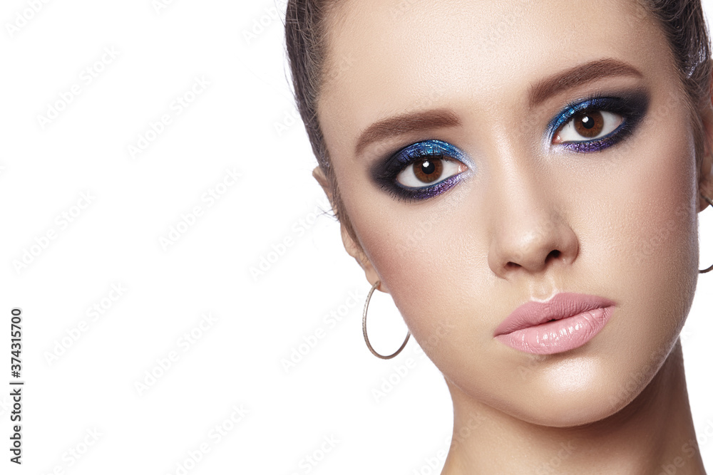 Fototapeta premium Beautiful Woman with Professional Makeup. Celebrate Style Eye Make-up, Perfect Eyebrows, Shine Skin. Bright Fashion Look