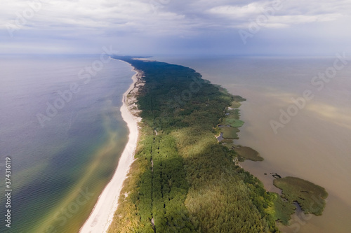 Drone view of whole curonian spit in sunny day, spit between sea and gulf