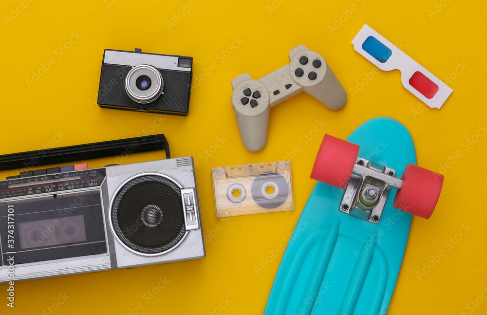 Retro old school attributes 80s on yellow background. Top view. Flat lay - obrazy, fototapety, plakaty 