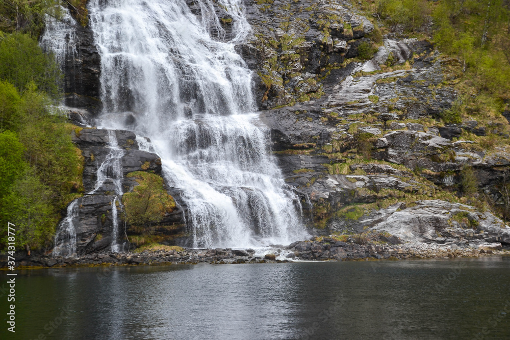 Falls in mountains of Norway in rainy weather. Norway waterfalls