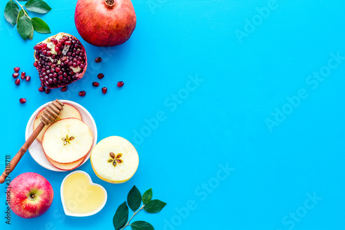 Rosh Hashana jewish new year concept. Apple and honey on the table, top view