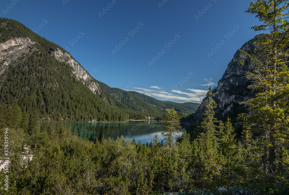 Lago di Braies, a charming, crystal clear alpine lake, located at the foot of Croda del Becco mountain, Alta Via 1 trek starting point, Prags Dolomites, Trentino-Alto Adige, South Tirol, Italy. Lago di Braies, a charming, crystal clear alpine lake, located at the foot of Croda del Becco mountain, Alta Via 1 trek starting point, Prags Dolomites, Trentino-Alto Adige, South Tirol, Italy.