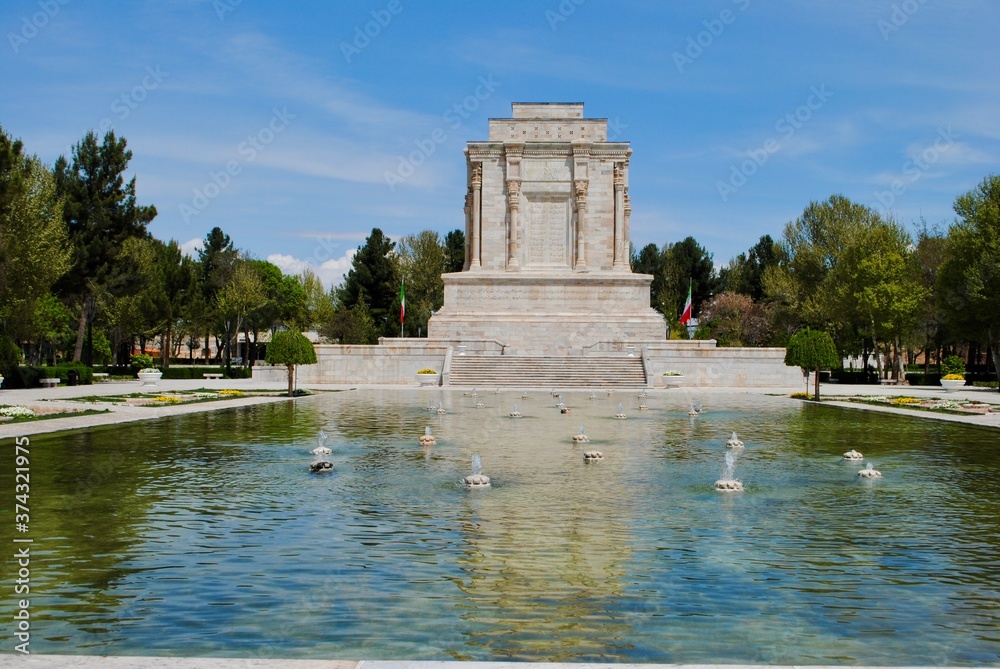 The exterior with pond of tomb of Ferdowsi, the renowned Persian poet from 10th century. Mashhad Iran The exterior with pond of tomb of Ferdowsi, the renowned Persian poet from 10th century. Mashhad Iran