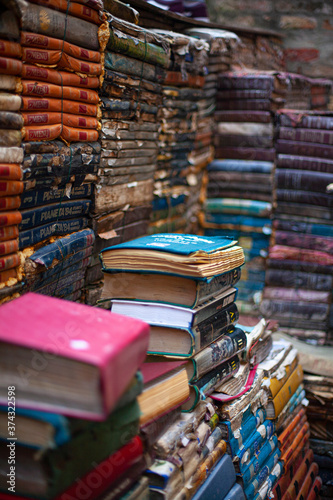 stack of colorful books in a bookstore