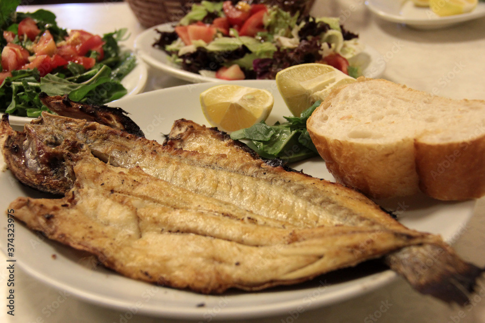 delicious fish and salads on presentation plate delicious fish and salads on presentation plate