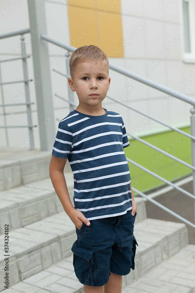 Happy cute smart boy with school bag. Modern backpack. First time at school. Back to school Happy cute smart boy with school bag. Modern backpack. First time at school. Back to school