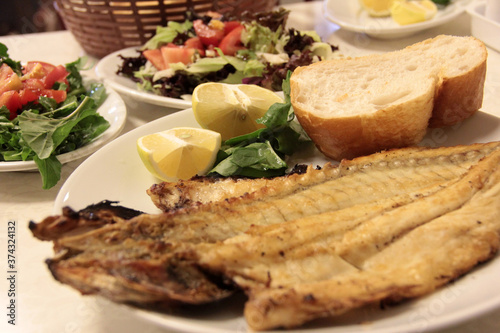 delicious fish and salads on presentation plate