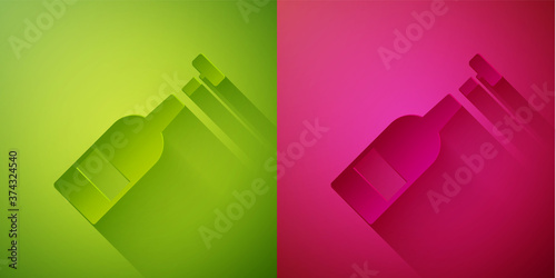 Paper cut Opened bottle of wine icon isolated on green and pink background. Paper art style. Vector Illustration.