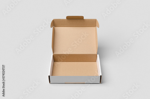 Cardboard postal, mailing box mockup with opened lid. © Shablon