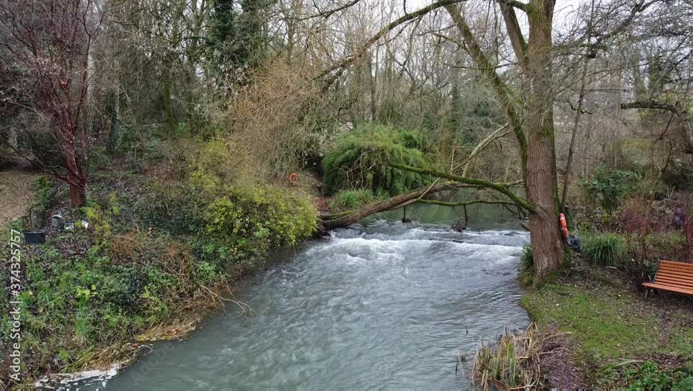 Aerial view, static camera. River in the garden in the village of Malmsbury, England. Aerial view, static camera. River in the garden in the village of Malmsbury, England.