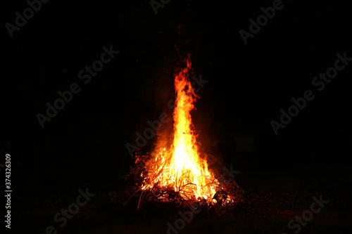 Big bright bonfire in the pitch darkness of the night