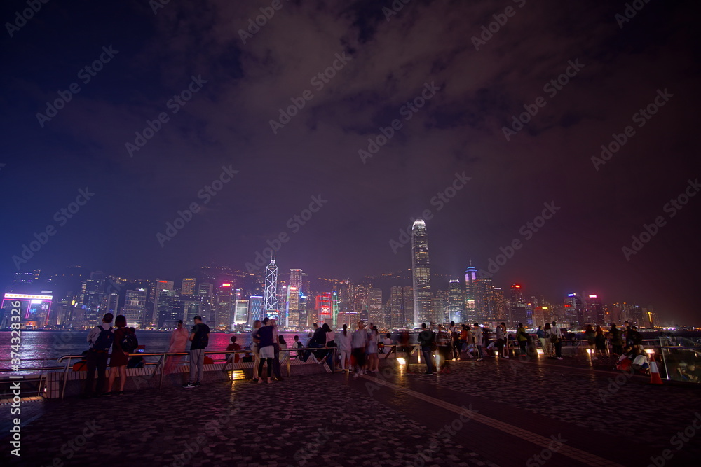 Obraz premium City landscape. Victoria Harbor and Hong Kong skyscrapers at night