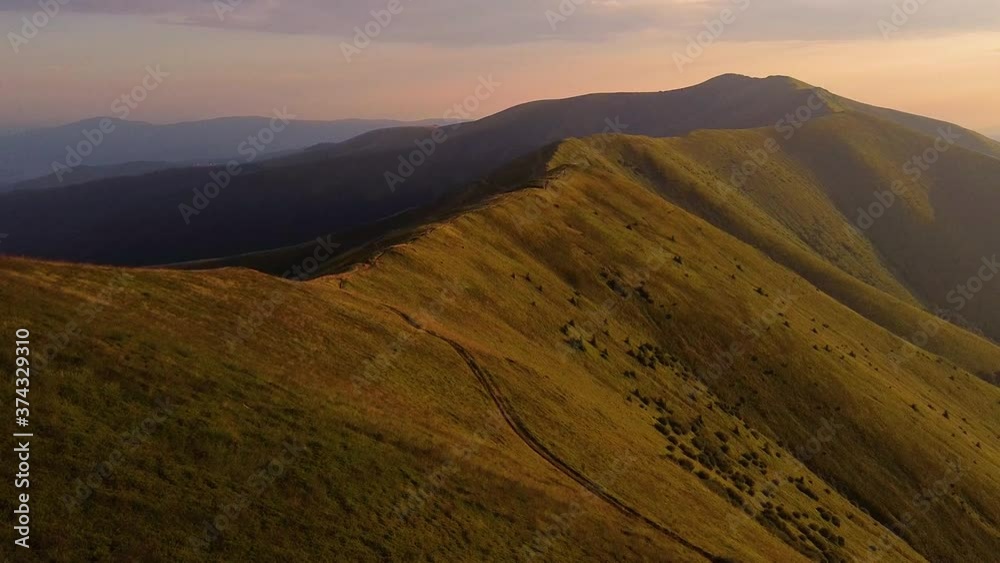 Aerial shot of Alps mountains. Mountains, peaks, cliffs, rocks, ridges, landscape, green grass, sky, clouds, nature, uncultivated nature, drone video. Aerial shot of Alps mountains. Mountains, peaks, cliffs, rocks, ridges, landscape, green grass, sky, clouds, nature, uncultivated nature, drone video.