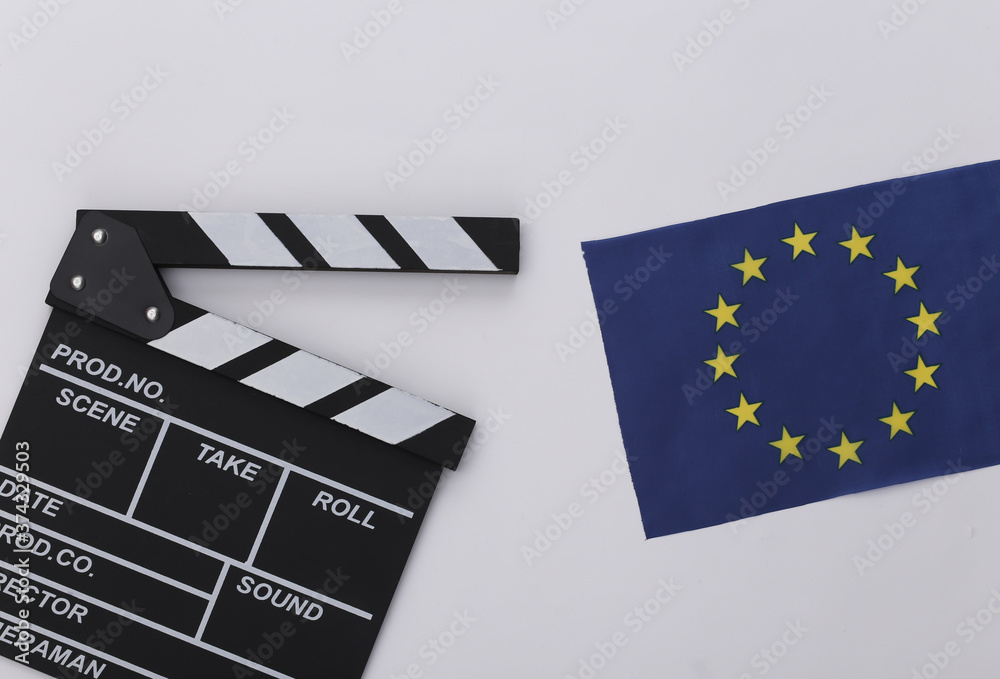 Movie clapper board and EU flag on white background. Filmmaking, Movie production, Entertainment industry. Top view